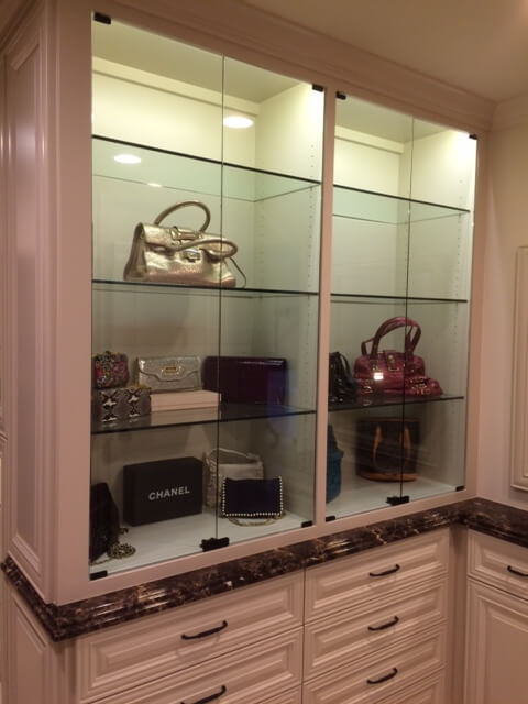 Glass Shelves Built-in display cabinet with custom glass shelves professionally installed by Westoaks Glass & Mirror.
