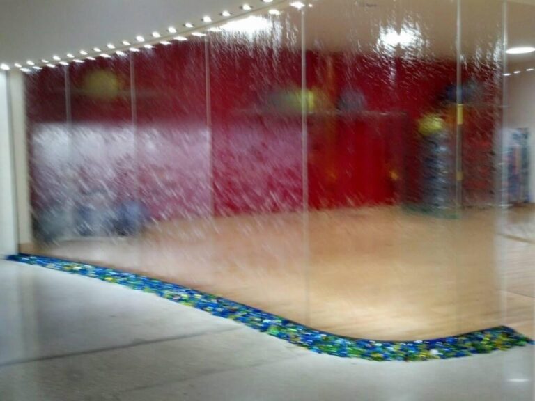 Glass Water Wall Decorative glass water wall feature installed in a commercial space by Westoaks Glass & Mirror.