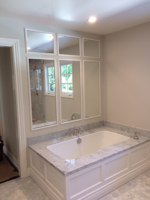 custom-bathroom-wall-mirrors-installation Custom bathroom wall mirrors installed above bathtub by Westoaks Glass & Mirror.