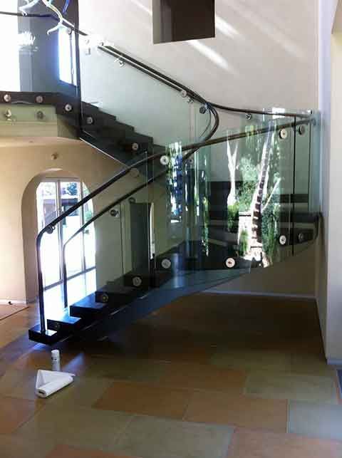 glass-railing Elegant staircase with custom glass railings and stainless steel fittings installed by Westoaks Glass & Mirror.