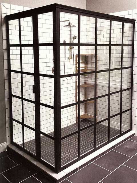 glass-shower-door-framed Framed glass shower enclosure with black grid design and white subway tile walls installed by Westoaks Glass & Mirror.
